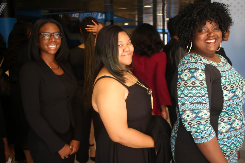 Black student graduates lining up 4